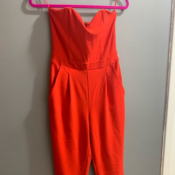 Express Pants - Express ankle length red strapless jumpsuit